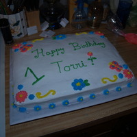 Torri's Birthday Cake Birthday cake I made for my sister's best friend's little girl.Tried the daisy for the first time. Surprisingly simple.