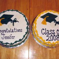 Graduation 2 2-layer 12" cakes, iced in buttercream with fondant cap and scroll
