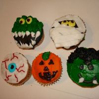 Halloween Cupcakes i borrowed the dea from many differnt people who had these,and i just haaad to make them, i made about 50!..and they were a crowd pleaser...