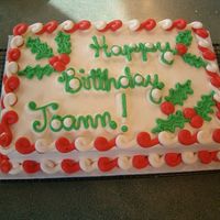 Holly Leaves A 9x13 2layer cake frosted in buttercream with buttercream holly leaves and berries and a candy cane border.