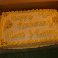 40Th Anniversary Just a 11x15 sheet cake filled and frosted in buttercream with fondant ribbon roses.