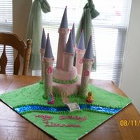 101_0766.jpg This was my first castle cake for my 3yr old niece. I had some trouble getting the center towers to stay straight. I tried to make some...