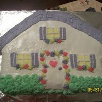 101_0577.jpg This was a house cake a friend asked me to make for her housewarming party. This was one of the 1st cakes I made while taking the wilton&#...