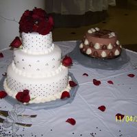 Wedding Cake 2 Another shot of my first wedding cake. It also shows the grooms cake which was strawberry shortcake covered with chocolate mousse.
