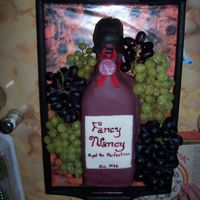 Wine Bottle Birthday Inspired by Nunuk's Wine bottle cake. All MMF, except ribbon. Fresh red and green grapes. Made during a time crunch so not as "...