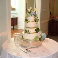 Cascading Roses And Hydrangeas Cake Continued. Side view of cascading roses and hydrangeas cake.