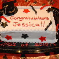 My Daughter's 8Th Grade Graduation Cake Double layer yellow cake, buttercream filling and icing with fondant accents.