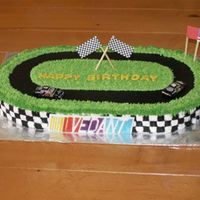 Nascar Birthday Cake Marble cake with custard filling, iced in buttercream. Cars and flags are non-edible. The plaque is gumpaste, and we took the birthday boy...
