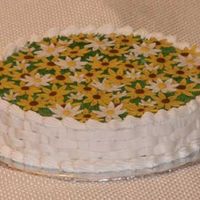 Basket Of Daisies Two-layer cake with buttercream basketweave sides. The 'grass' was done with Wilton's grass/hair tip, and the flowers were...