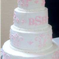 The First Wedding Cake! I made this cake for a friend of my mom's. WASC cake with cheesecake filling, buttercream icing. The bride forgot to order flowers for...