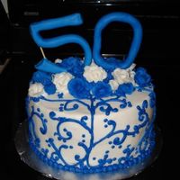 Blue Scrolls Chocolate cake, ganache filling, buttercream icing. Fondant 50. This was inspired by another CC member, but I cannot find the original...