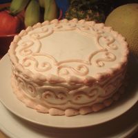 Dsc02624.jpg "Strawberry Cake from Scratch" recipe from the website, filled with fresh strawberries, and frosted with Wilton's Snow white...