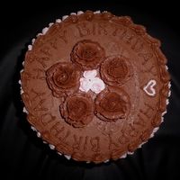 All Chocolate Birthday Cake Chocolate cake with fresh cherry filling. Chocolate buttercream and buttercream roses.