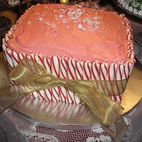 Candy Cane Cake red velvet cake, peppermint cream cheese frosting. add peppermint sticks and a big gold bow...... viola! easy. i made this for our annual...