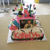 Hannah Montana Hannah montana 2 tier... Whip cream with fondant accents....