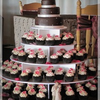 Pamelia Chocolate cupcakes with WBH Vanilla House Buttercream and fondant flower. Top cake and 8 cupcakes were gluten free (mix brand requested by...