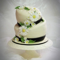 Daisies For Chrissy Chrissy's dress was ivory and black and she was carrying daisies. Toba's fondant with gp daisies. Small wedding dinner party....