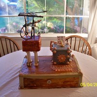 Wild Wild West Steam Punk Cake White cake with lemon filling and vanilla buttercream. Fondant and gum paste decorations. The base is painted butter cream.