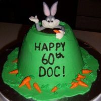 Bugs Bunny Cake Taken from Debbie Brown's Character Cakes book. (I just used a LOT less carrots!) Buttercream icing, fondant Bugs Bunny & carrots...