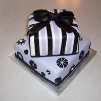 011.jpg The idea for this cake came from the Pottery Barn Teen catalog. I got the color scheme & some of the flower designs from it... was a...