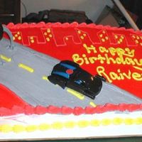 Incredibles Birthday Cake I used the Wilton red color mist to give it the airbrushed look and used Happy Meal toys for the toppers.