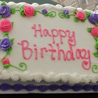 Floral Birthday Cake This is a quarter sheet cake done in buttercream frosting. I love the roses on it.