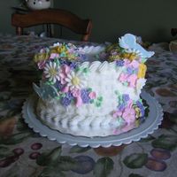 Wilton Class 2 bc icing with royal icing flowers and bird