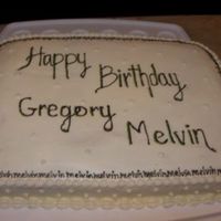 Dscn4608.jpg buttercream icing, with black buttercream writing. edge is name printed all the way around.