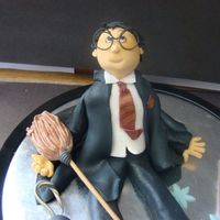 Harry Potter My first attempt at decorating a cake. Harry has fallen off his broom. I made loads of mistakes but I am totally addicted! All gumpaste