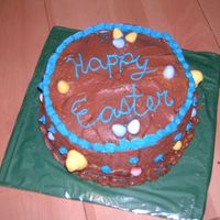 Hpim1680.jpg Easter cake. I used mini eggs and peeps to decorate (the peeps are the yellow things on the side of the cake).