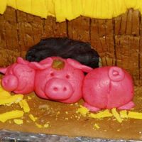 Fondant Nightmare - A Close-Up Take a closer look at the melting pigs, if you dare.