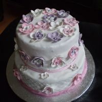 50Th Birthday Cake This was a cake made for a 50th birthday party. There are 50 flowers all handmade as it was important the number was subtle! The cake...