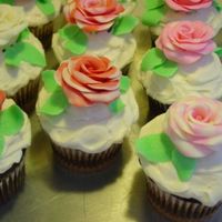 Valentine's Day Rose Cupcakes White chocolate roses on buttercream-topped marble cupcakes.