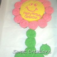 My Daughters Flower this is a cake I came up with for something different to take to school for my daughters birthday. She and the class loved it.