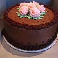 Wilton Course I Final This is my final project cake for Course I. The cake is yellow, filled with chocolate bavarian cream, and iced in chocoloate buttercream. I...