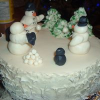 Snowmen Cake Snowmen snowball fight with penguins and trees. Mostly fondant.