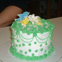 Cakeschristmasamber_024.jpg small six inch cake. all buttercream, with royal icing flowers.