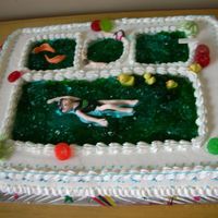 Swimming Pool Can you see her swimming school logos on her swim suit and cap?I had too much fun making this cake:)