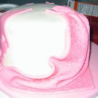 First Cake For Fondant & Gumpaste Course I like how the draping came out on this cake. It was my first time trying draping but it came out pretty good.