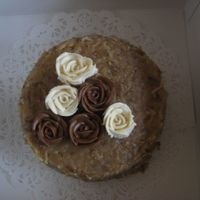 L_026.jpg Just practicing my buttercream roses, on a german chocolate cakeI definitely need practice.