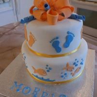Fishies And Baby Feet Covered in Fondant, Fondant Bow with Fondant Decorations...