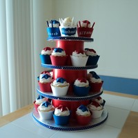 Red, White And Blue Cupcake Tower 30 French vanilla cupcakes, iced in buttercream. Stars are made out of chocolate. I made the cupcake wrappers and the cupcake stand. TFL!