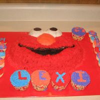 Elmo For 2Nd Birthday Chocolate Elmo cake, white cupcakes, and white mini cupcakes. All frosted with buttercream. For my cousin's boyfriends little girl who...