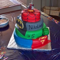 Superhero Squad Was a combo of a few cakes I saw on CC. Covered in fondant, Batman and supman logos are gumpaste, hulks hand was an actual mold of my sons...