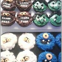 Halloween Cupcakes wilton designs (werewolve, vampire, mummy, and cyclops). i made these for my little brothers' (twins) 1st grade halloween party....