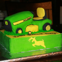 John Deere Mower Cake I made this cake for my dad's bday. This is my first time carving a cake. Cake is covered with mmf and gumpaste and mmf accents.