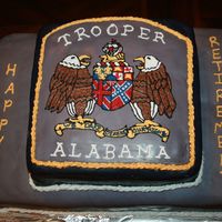 Alabama State Trooper Retirement Cake This cake was made for my husband's Sgt. It is the patch on the sleeve of the uniform. It is covered with mmf.