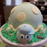 Baby Turtle This is a turtle made to go on top of a cupcake tower. All fondant decor. Made with 1/2 sports ball pan and 6 in round. I was sad to let...