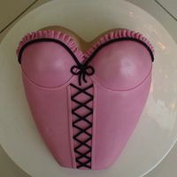 Pink Bustier Cake I made this for my DH's 49th birthday using the wilton dolly varden pan (I think that's what it's called) and a 9 inch...