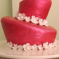 Annie's 5Th Birthday Chocolate cake with chocolate ganache filiing, covered with fondant and hand painted with 'cranberry' lustre dust. Gumpaste...